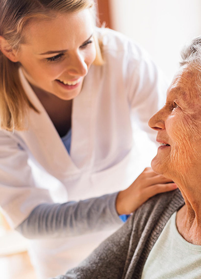A caregiver sharing a warm moment with a resident
